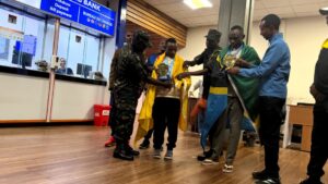 Tanzanian JKT athletes arriving at Kilimanjaro International Airport to a warm reception after their successful performance at the Maratona FMO marathon in Brazil.